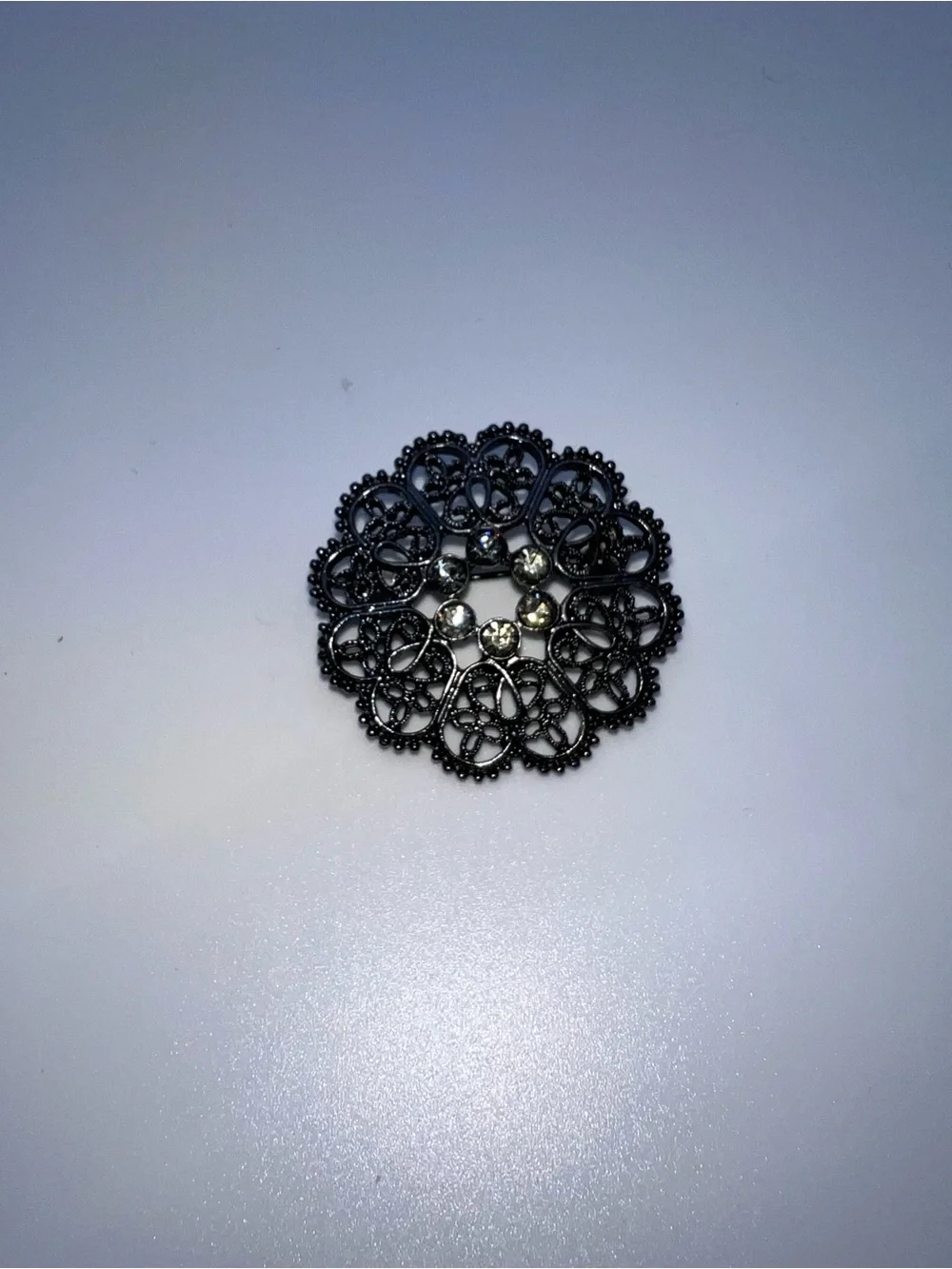 Black Filigree Round Brooch with Crystal Accents